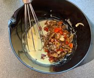 Mixing the veggies into the vegan omelette batter