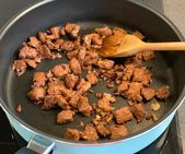 Stir-frying vegan "beef" chunks