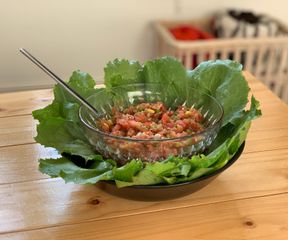 Green chilli salsa in a bed of organic lettuce