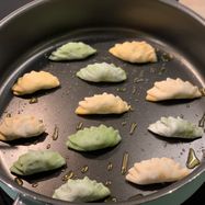 Frying and steaming gyoza dumplings