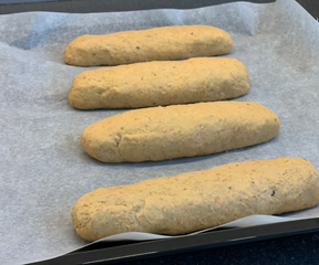 Making mini baguettes out of the herb bread